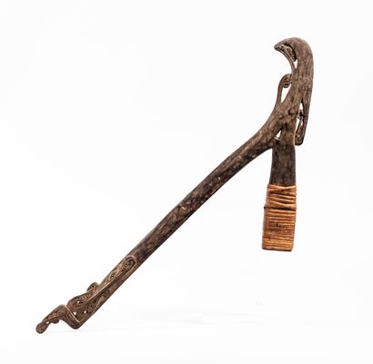 null Adze 
Massim, Papua New Guinea
Carved wood, rattan
H. 66.5 cm

This light wood...