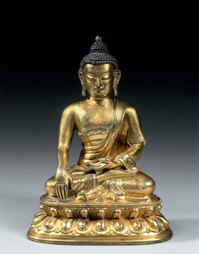 null Bouddha Sakyamuni Chine XVIIIe Bronze doré H. 17,2 cm Le Bouddha est représenté...