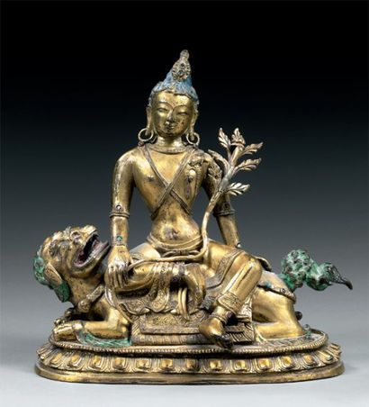 null Avalokitesvara sur un lion Chine XVIIIe Bronze doré H. 15,5 cm Le Bodhisattva...