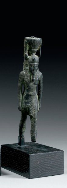null Statuette votive représentant le dieu Néfertoum Il est debout, marchant, les...