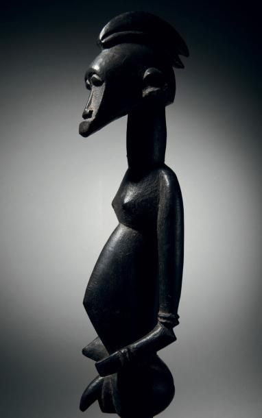 null Superbe statuette masculine Sénoufo, Côte d'Ivoire
Bois à patine noire, la jambe...