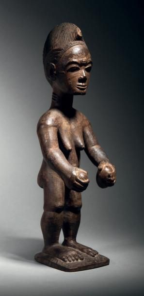 null Statue Baoulé, Côte d'Ivoire
Bois à patine brun foncé noir granuleuse
H. 40,5...