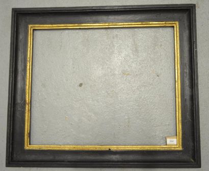 null CADRE en bois mouluré noir et or. Italie, XIXe siècle (noir refait).
48,8 x...