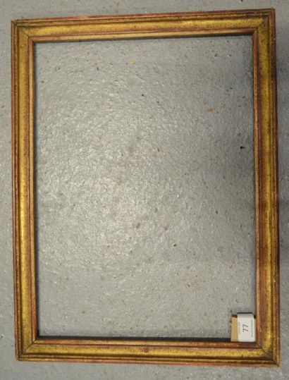 null BAGUETTE en bois mouluré et doré. Époque Louis XVI (usures).
29,7 x 40,8 cm...