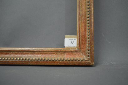 null BAGUETTE en bois sculpté et doré à décor de perles.
Époque Louis XVI.
40 x 50,8...