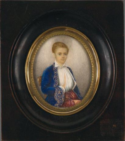 ECOLE FRANÇAISE VERS 1800 Portrait d'un jeune homme assis en habit de velours bleu...