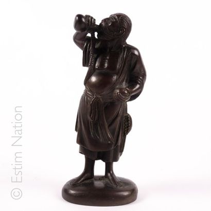 CHINE CHINA

Drinking
Man Bronze test with brown patina depicting a drunk standing...