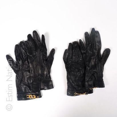 HERMES Paris, Anonyme TWO PAIRS OF GLOVES in black goatskin, the first one decorated...