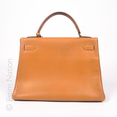 HERMES PARIS (1990) 32 CM "KELLY" BAG in Courchevel gold leather with its shoulder...