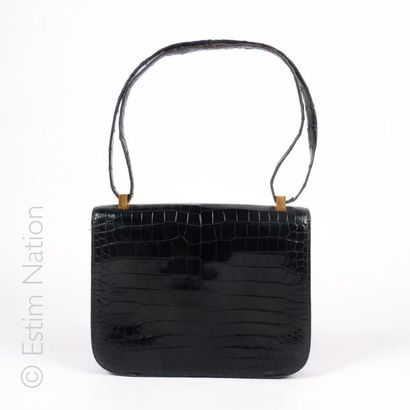 HERMES PARIS CIRCA 1973-1975 BAG "CONSTANCE" in black crocodile, gold plated trimmings...