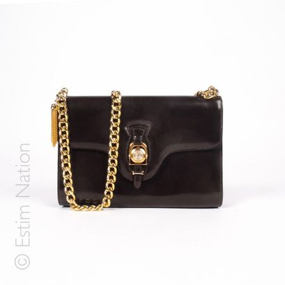 GUCCI vintage SMALL BAG in brown box, flap decorated with a stirrup retaining a quartz...