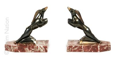 H. MOREAU (d'après) Pair of silver bronze bookends representing two stylized ibexes....