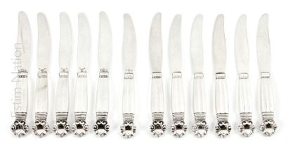 COUTEAUX Suite of twelve fruit knives with 925 thousandths silver blade, the silver...