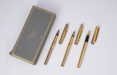 CHRISTIAN DIOR SET composed of three gilded gilt metal nibs, one of which is engraved...