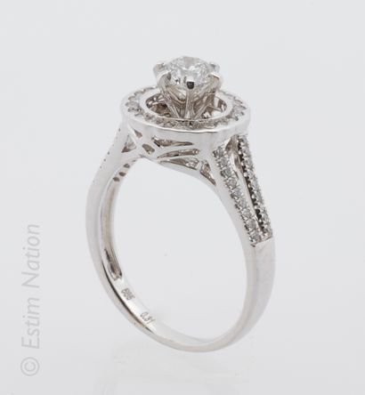 BAGUE OR Ring in white gold 14K (585 thousandths) openwork, ornamented with a diamond...