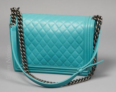 CHANEL (2014) 
BAG "BOY" in turquoise quilted lambskin with its dust bag, handles...