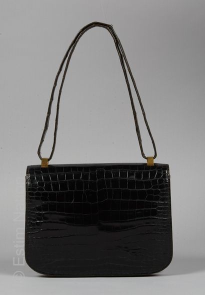HERMES PARIS CIRCA 1970/73 BAG "CONSTANCE 23 CM" in black glossy estuary crocodile,...