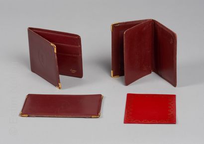 CARTIER THREE PIECES OF LEATHERWORK in burgundy box: gold-plated metal corners including...