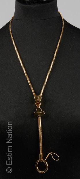 CHAOS ACCESSOIRE pour téléphone formant collier zippé en métal doré (dans son éc...