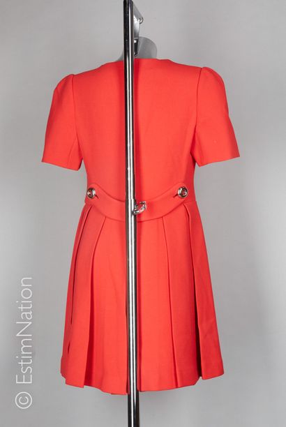 PRADA (2011) 
Red woolen dress, small sleeves, pleated skirt in the back with a martingale...