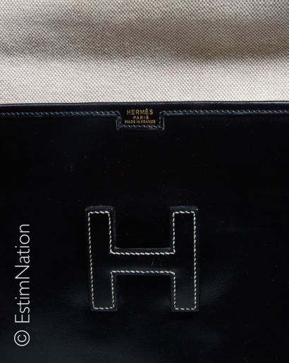 HERMES (1989) POCHETTE " JIGE" en box noir surpiqué beige, intérieur en toile H (20...