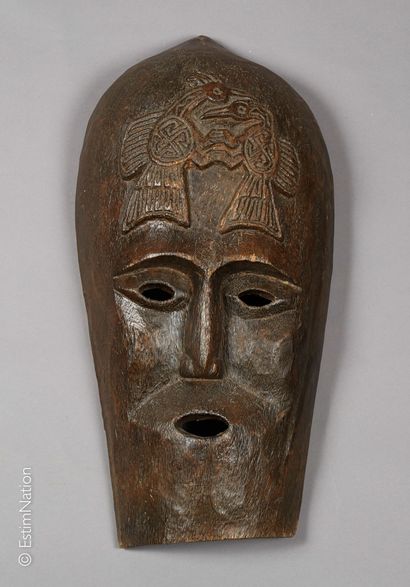 TIMOR TIMOR



Anthropomorphic mask out of carved wood with engraved decoration on...