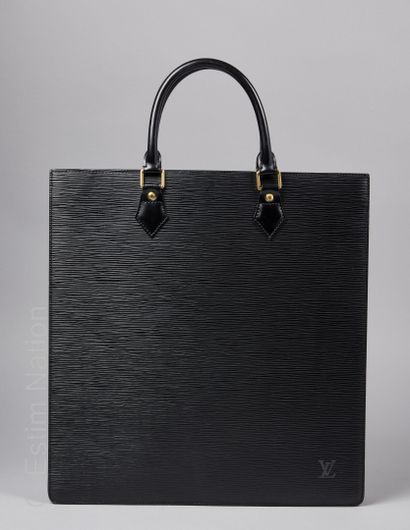 LOUIS VUITTON (2002) Flat" bag in black epi leather with a zipped pocket in the grey...