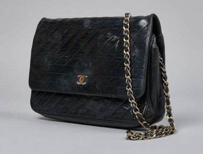 CHANEL CIRCA 1970 BAG with flap in black bias stitched leather, lining in ottoman...