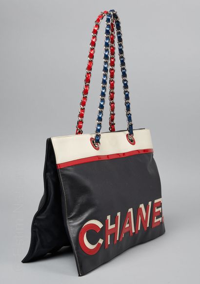 CHANEL (2002/2003) CABAS in black, white and red calfskin embellished with a blue...