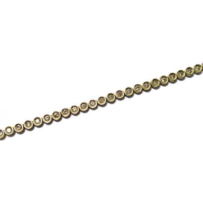 Bracelet BRACELET articulé en or jaune 18k (750/°°), orné d'une ligne de diamants...