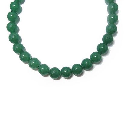 COLLIER COLLIER composé d'un rang de perles de jaspe vert d'environ 14 mm; fermoir...