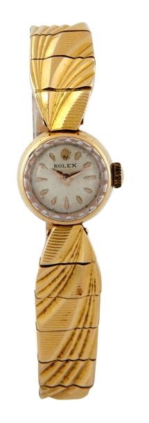 MONTRE ROLEX Montre bracelet de femme en or jaune 18k 750/°° boitier rond fond clipé...