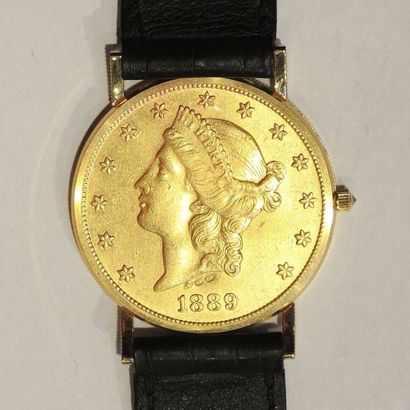CORUM CORUM
TWENTY DOLLARS vers 1970.
Montre bracelet pièce de 20 dollars en or jaune...