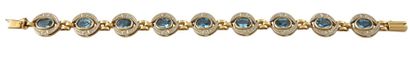 Bracelet Bracelet articulé en or jaune 14K 585/°° composé de pierres bleues en serti...
