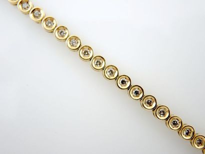 Bracelet diamants Bracelet en or jaune 18K 750/°° présentant des motifs ronds sertis...