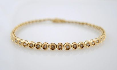 Bracelet diamants Bracelet en or jaune 18K 750/°° présentant des motifs ronds sertis...
