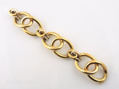 BRACELET MANCHETTE EN OR DEUX TONS Bracelet manchette articulé en or deux tons 18K...