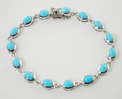 BRACELET TURQUOISE Bracelet articulé en argent (925/°°) composé de cabochons de turquoise...