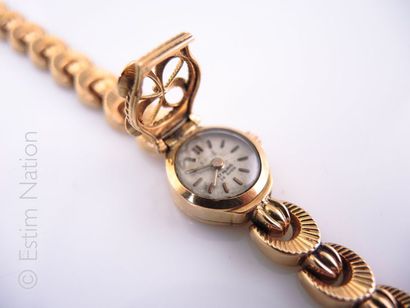 MONTRE DE DAME DITE MYSTÉRIEUSE Montre de dame dite mystérieuse en or jaune 18K (750°/00)...