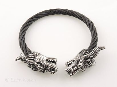BRACELET ACIER Bracelet en acier ouvrant présentant deux têtes de dragons affrontées...
