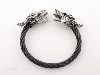 BRACELET ACIER Bracelet en acier ouvrant présentant deux têtes de dragons affrontées...