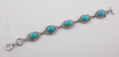 BRACELET ANNEES 1950-60 Bracelet articulé en métal rehaussé de 5 cabochons de turquoise...