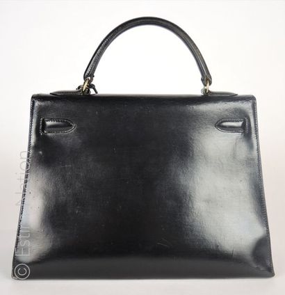 HERMES PARIS (1970) SAC "KELLY" 32 cm en box noir, cadenas, deux clés sous clochette...