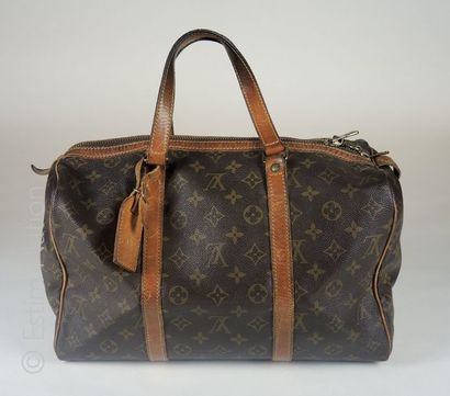 LOUIS VUITTON circa 1975 SAC ''KEEPALL'' en toile Monogram et cuir naturel, cadenas,...