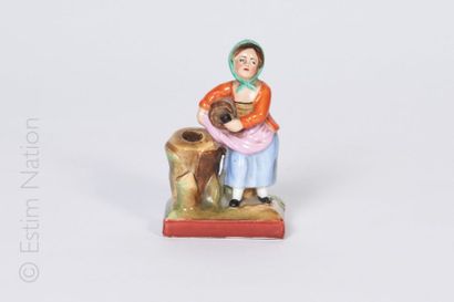 PORCELAINE DE PARIS Figurine en porcelaine polychrome représentant une petite fille...