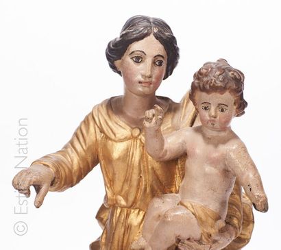 ITALIE - VIERGE A L'ENFANT Vierge à l'enfant en bois sculpté et doré, le corps de...