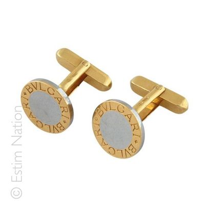 BULGARI Paire de boutons de manchettes en or jaune 18K 750/°° et acier de forme ronde...