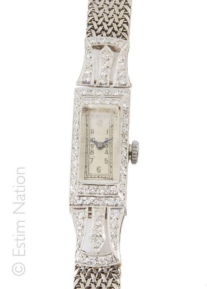 MONTRE DE DAME PLATINE DIAMANTS Bracelet montre de dame en or gris 18K (750/°°) et...