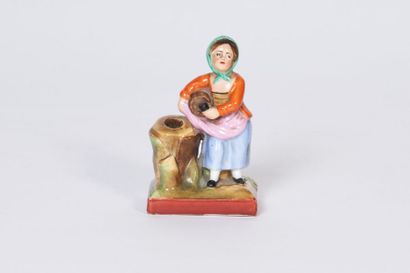 PORCELAINE DE PARIS Figurine en porcelaine polychrome représentant une petite fille...