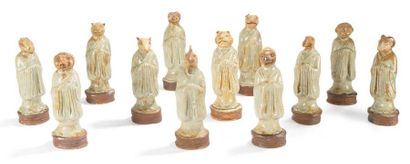 null Ensemble de douze statuettes en céramique et émail céladon «grès du Guandong»...